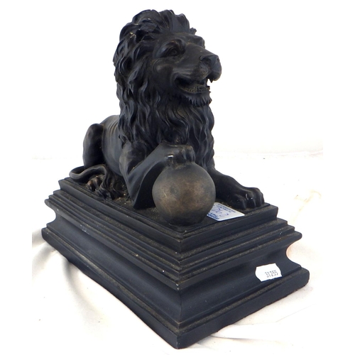 292 - A small cast lion together with a resin recumbent lion (2)