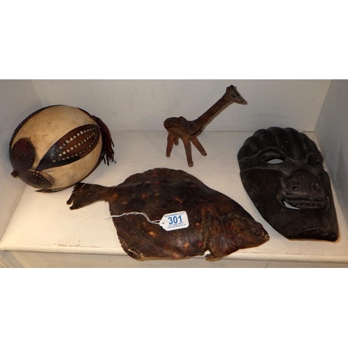 301 - A unusual leather model of a fish together with a carved hardwood mask etc (4)