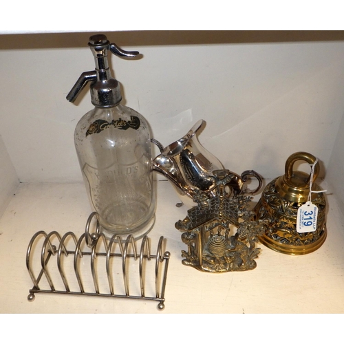 319 - A brass saints bell together with a brass bears plaque, soda syphon, epns toast rack, jug, gravy boa... 