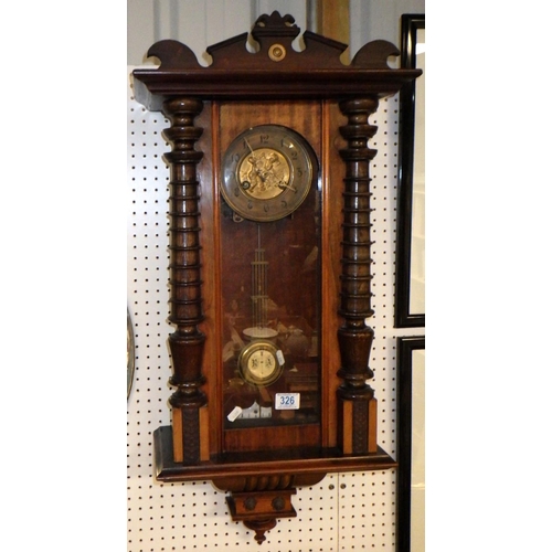 326 - A 19thC Vienna wall clock 80cm long