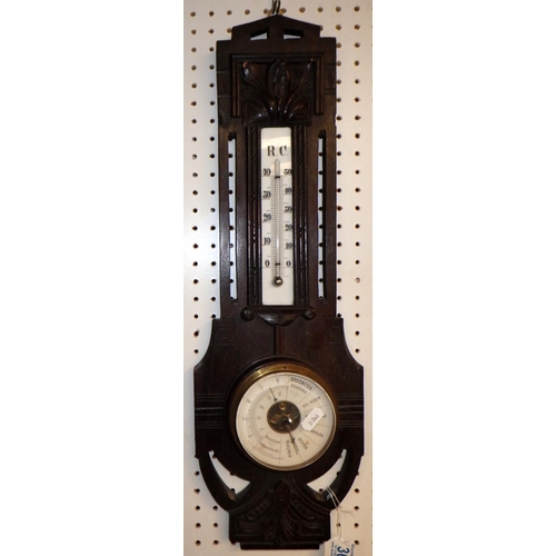 367 - A carved oak barometer together with a framed stainless plaque of a knight (2)