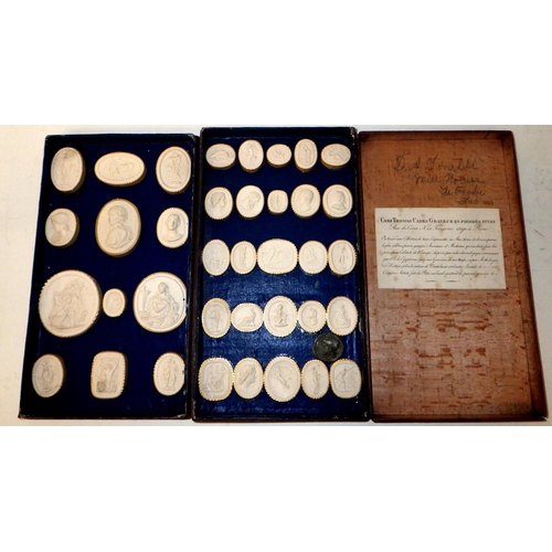 398 - A collection of plaster casts of seals and medals, presented in a two tier wooden case bearing a Rom... 