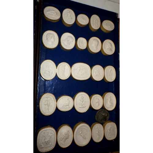 398 - A collection of plaster casts of seals and medals, presented in a two tier wooden case bearing a Rom... 