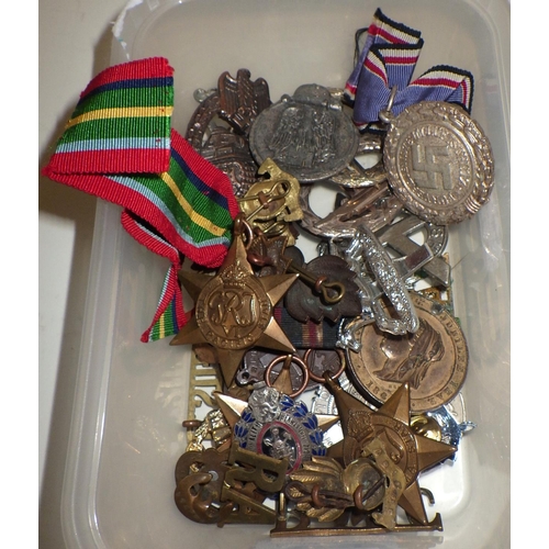 404 - Various military interest medals and badges; other badges etc.