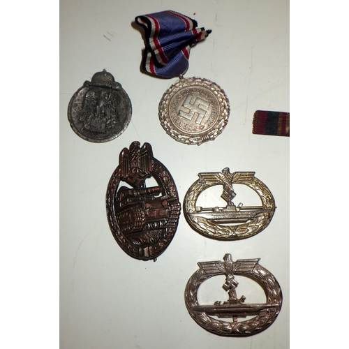 404 - Various military interest medals and badges; other badges etc.