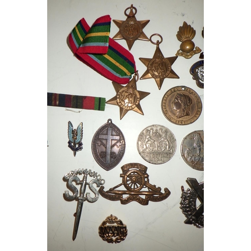 404 - Various military interest medals and badges; other badges etc.