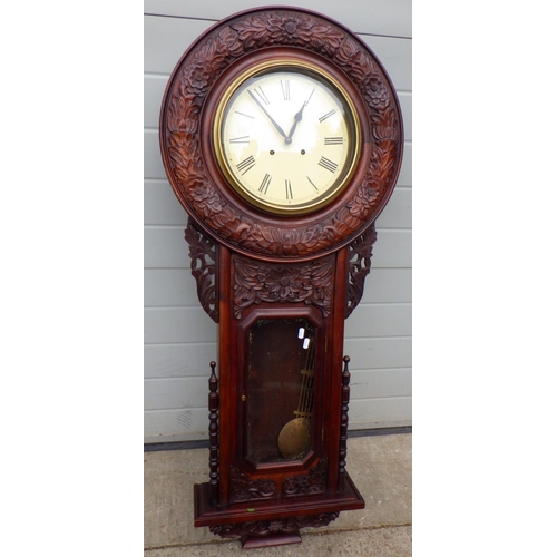 456 - A carved drop dial wall clock, 134cm tall