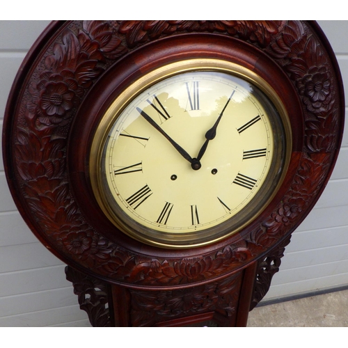 456 - A carved drop dial wall clock, 134cm tall