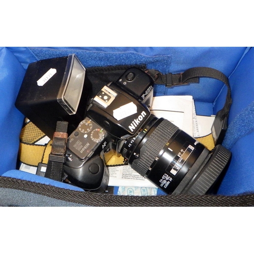 412 - A Nikon F4015 camera with telephoto lens and flash along with an Olympus OM10 camera and a Panasonic... 