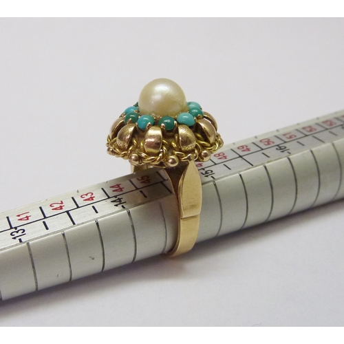 417 - A cluster ring, comprising a central pearl surrounded by a halo of turquoise, unmarked yellow metal.... 