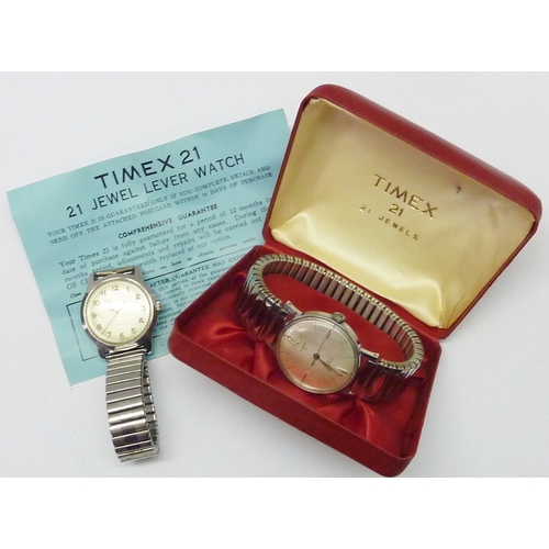 428 - A Timex 21 manual wind chrome cased wristwatch, 32mm across, in original box; a Bulova Self-Winding ... 