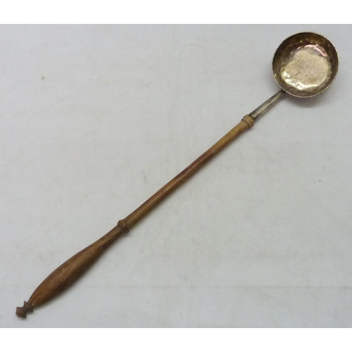 437 - A George III toddy ladle, unmarked white metal and turned wood, the bowl base engraved 