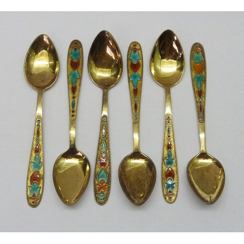 439 - Six matching Russian gilt white metal and enamel coffee spoons, late 20th cent. Each 115mm long.