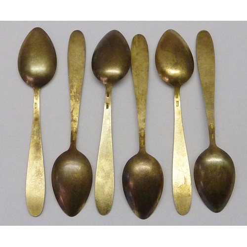 439 - Six matching Russian gilt white metal and enamel coffee spoons, late 20th cent. Each 115mm long.