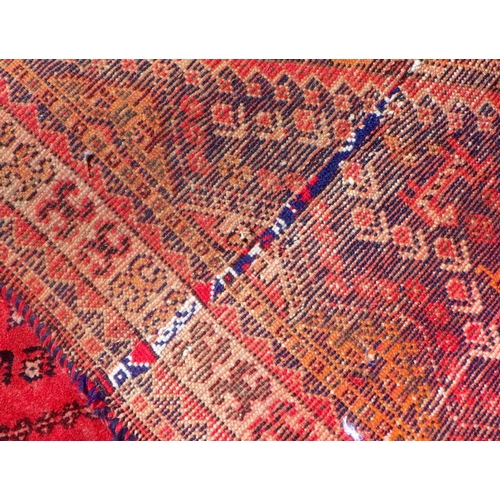 601 - Kashgai carpet, the faded rose pink field of boteh and geometric devices around a stepped medallion,... 