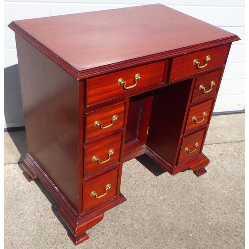 607 - A reproduction mahogany kneehole desk, marks, 87cm wide