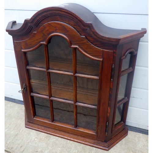 612 - A Dutch style wall mounted cabinet with arched top, 67cm wide