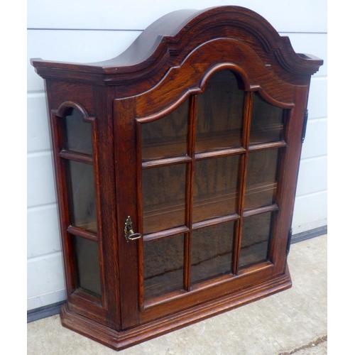 612 - A Dutch style wall mounted cabinet with arched top, 67cm wide