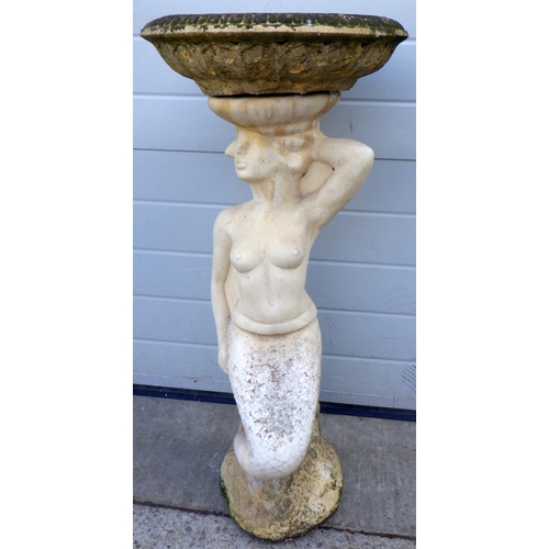 618 - A concrete mermaid bird bath, 92cm tall