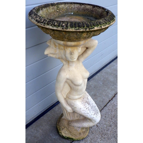 618 - A concrete mermaid bird bath, 92cm tall