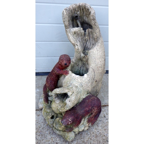 619 - A garden concrete water feature with otters, 56cm tall