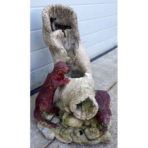 619 - A garden concrete water feature with otters, 56cm tall