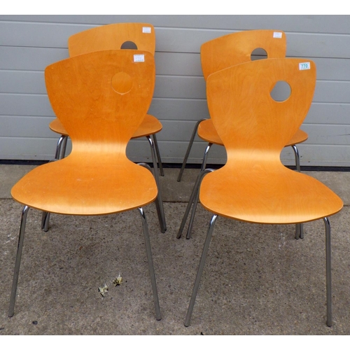 621 - A set of four retro style stacking chairs with label Godfrey Syrett Ltd