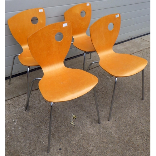 621 - A set of four retro style stacking chairs with label Godfrey Syrett Ltd