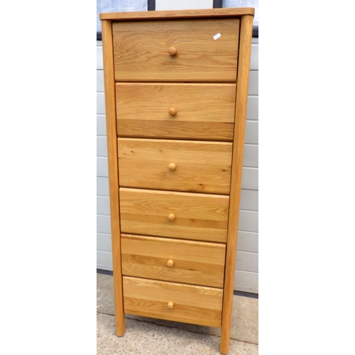 625 - A tall modern light oak chest of drawers, 55cm wide, 142cm tall