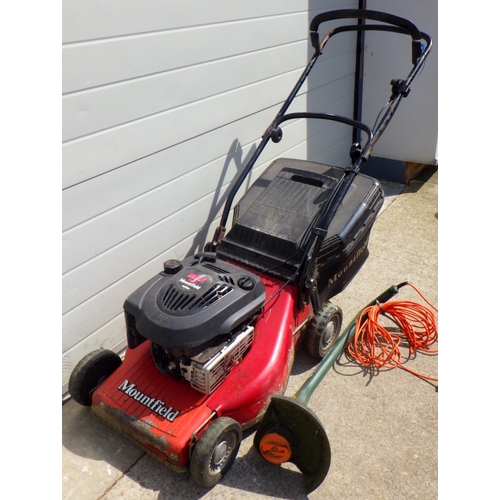 628 - A Mountfield petrol lawnmower together with a Black & Decker electric strimmer (2)