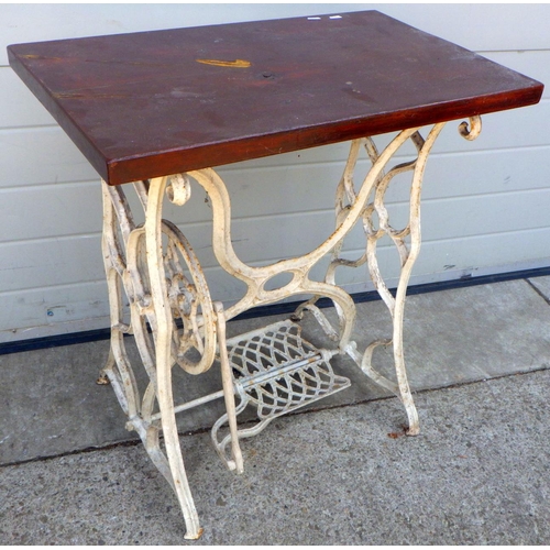 629 - A white painted treadle sewing machine base with top 71cm wide