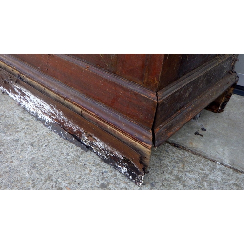 633 - An Edwardian panelled mahogany narrow cupboard, 61cm wide, base rotten (a/f)