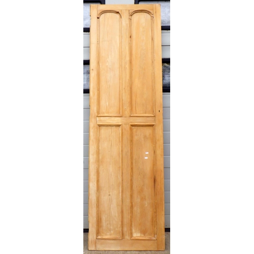 637 - A stripped pine four panel cupboard door, 69cm wide x 228cm tall