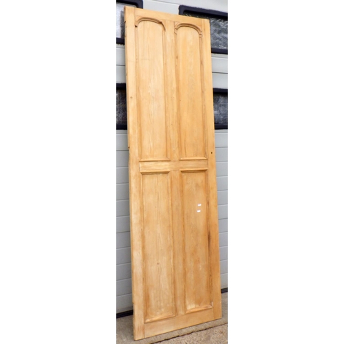 637 - A stripped pine four panel cupboard door, 69cm wide x 228cm tall