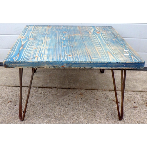 639 - A blue painted coffee table on metal legs, 68cm long