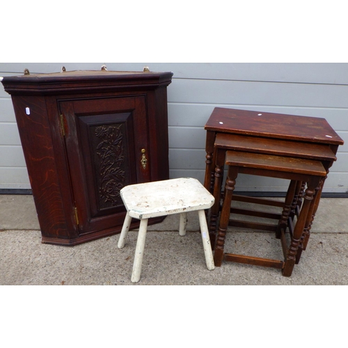 646 - An oak nest of tables on turned legs, carved oak corner cupboard and white painted stool (3)