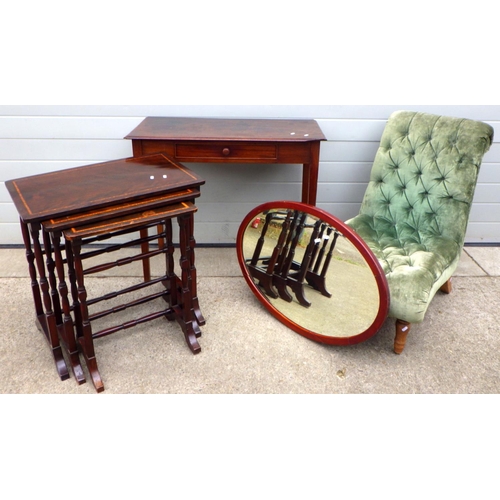 651 - A nest of three occasional tables, oval mirror, side table, button upholstered chair (a/f) (4)