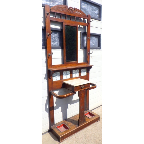 786 - A late Victorian oak hallstand, one hook broken, 92cm wide