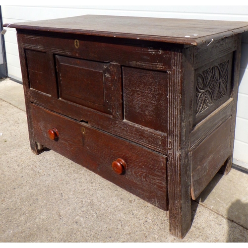 794 - A panelled oak box with lower drawer, 106cm wide