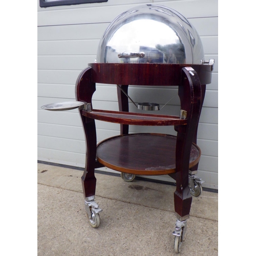 802 - A large dome topped meat trolley, veneer damage, 130cm tall approx