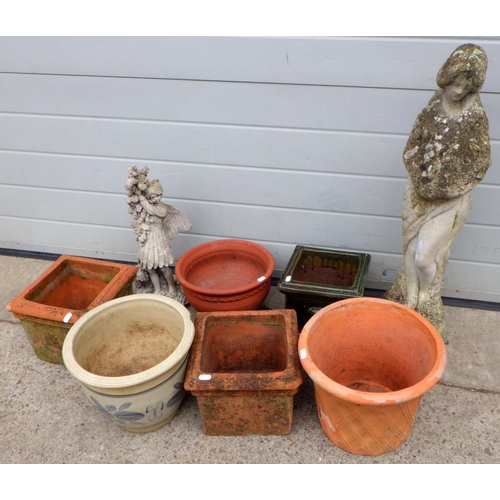 807 - A concrete garden statue, another figure and various planters