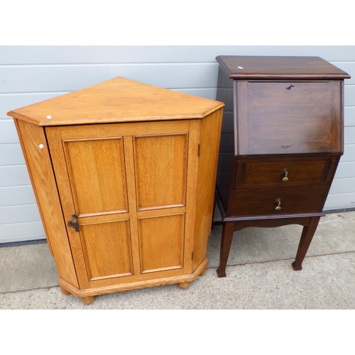 811 - A light oak low corner cupboard together with a narrow walnut bureau, a/f, one rest not sliding (2)