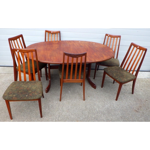 814 - A teak dining table together with six G.Plan dining chair frames