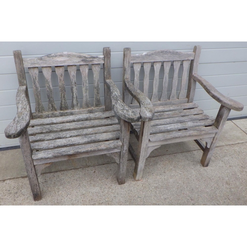 815 - A pair of teak garden chairs, feet a/f