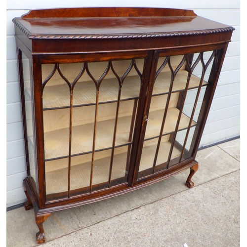 821 - A 1930's bowfronted China cabinet, 124cm wide