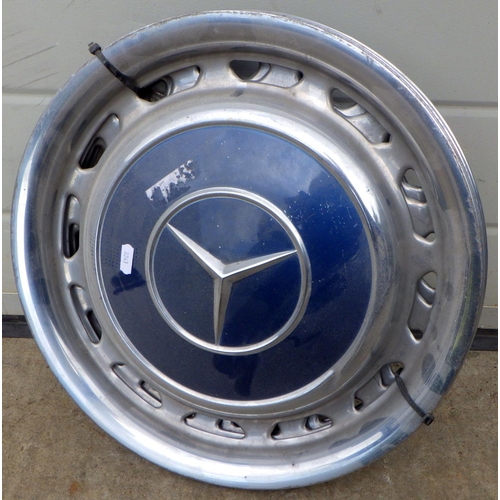 828 - A set of four 1970's Mercedes Benz hub caps