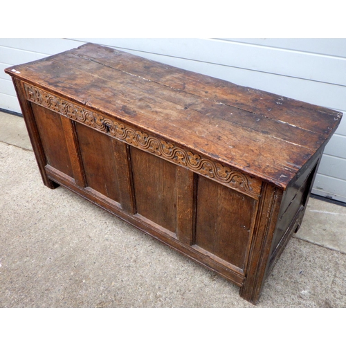 839 - A four panel oak coffer with carved initials E.B, a/f later bottom boards, hinge broken, repairs, 13... 