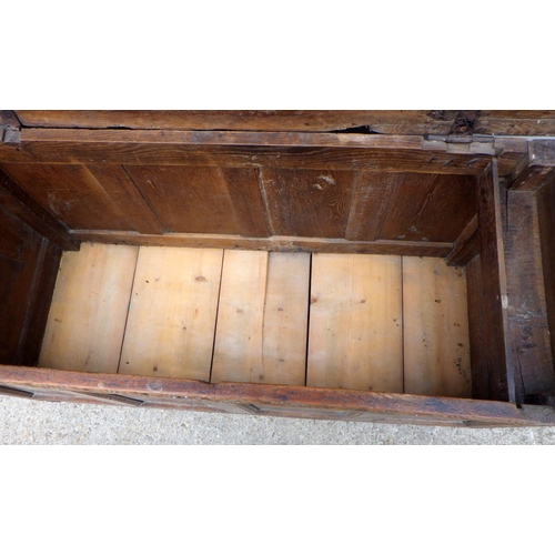 839 - A four panel oak coffer with carved initials E.B, a/f later bottom boards, hinge broken, repairs, 13... 