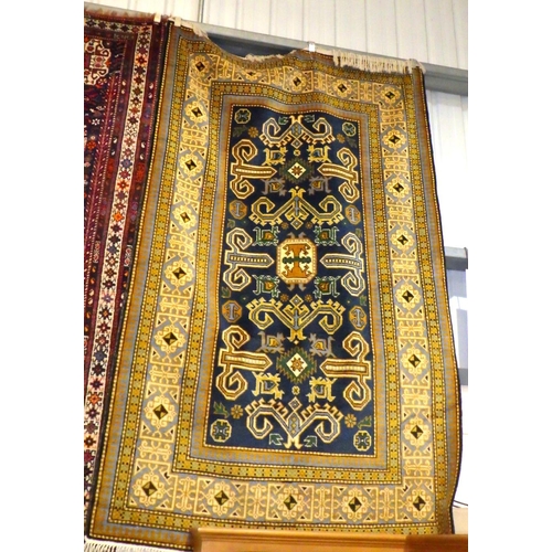 843 - A blue/gold ground rug, approx 265cm x 150cm