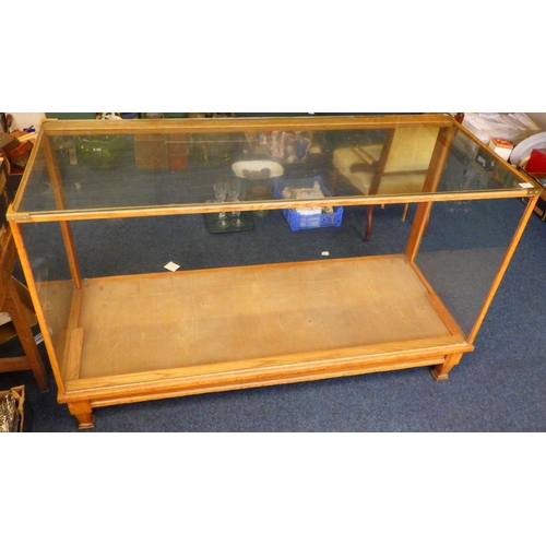 850 - An Edwardian light oak shop cabinet/counter, missing doors & shelves, added strengthened glass top, ... 